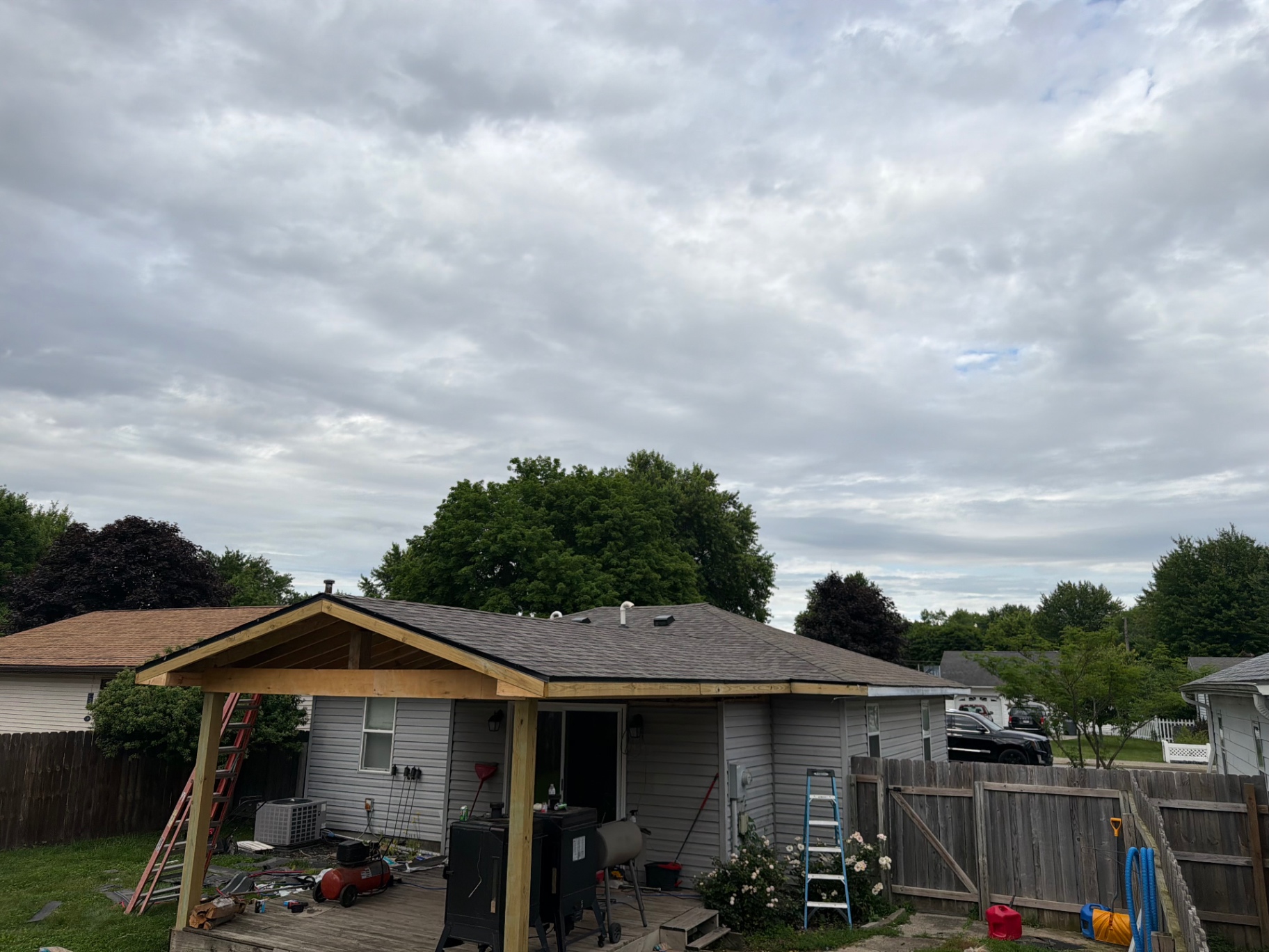 TrustBridge crew framing a new covered patio addition