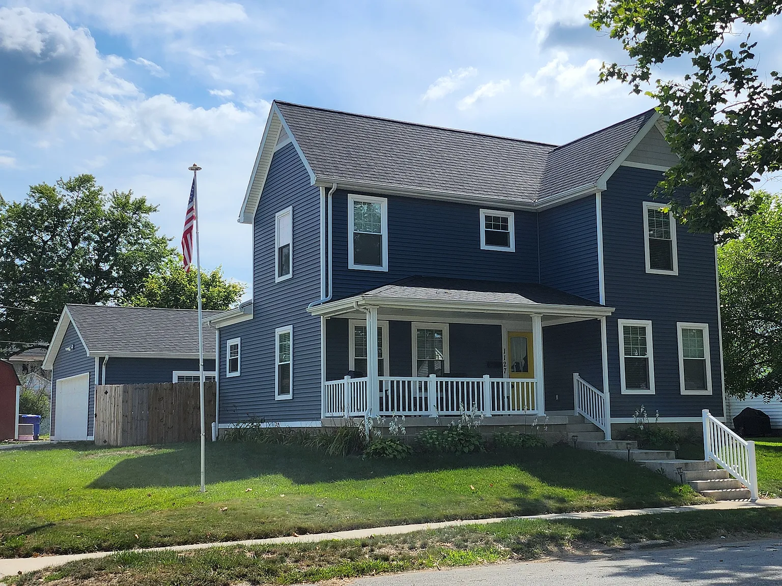 Navy exterior siding and porch restoration